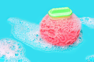Obraz na płótnie Canvas Human Brain Model with Toy Scrubber and Foamy Bubbles