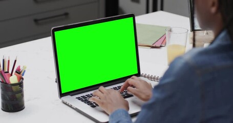 African american female student using laptop with copy space on screen