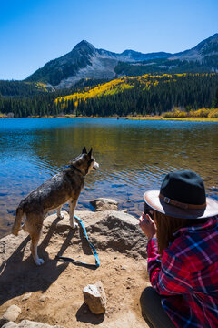 Woman Photographing Dog in Crested Butte, Colorado during Fall