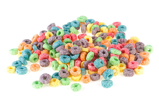 Pile of delicious and nutritious fruit cereal rings isolated on a white background. Colored sweetened corn cereals.