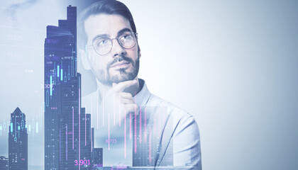 Portrait of attractive thoughtful young european man with glasses on abstract double exposure city background with candlestick forex chart and mock up place. Trade, ceo and finance concept.