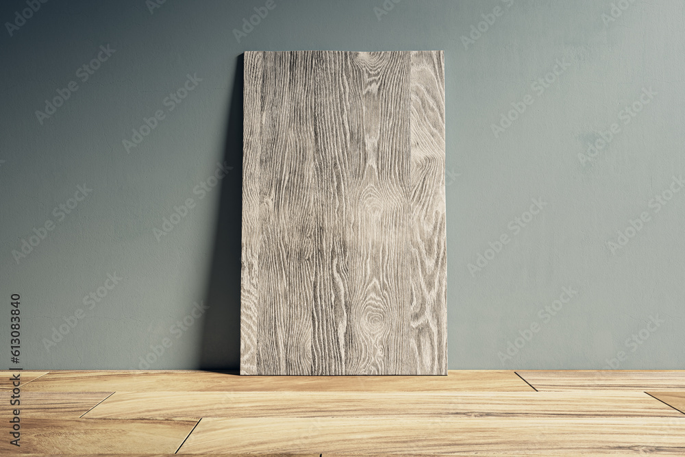 Poster clean gray wooden panel leaning on concrete wall. design and mock up template. 3d rendering.