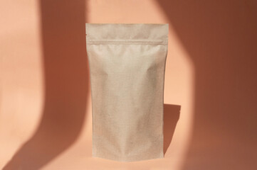 Layout of a clean paper kraft zip lock package on an orange background.