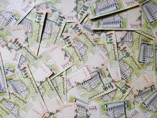 Pile of one thousand riyals Yemen banknotes.