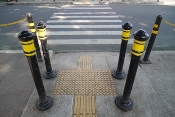 Zebra Cross is equipped with guardrails on the sidewalk and special tiles to guide the blind.