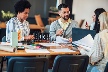 Modern business team discussing new ideas at the office. Business people on meeting in modern office.