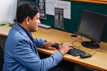 Fototapeta na wymiar Indian corporate employee working at office