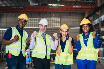 Team engineers and foreman stack hand and shake hands to show success at factory machines. Worker industry join hand for collaboration.