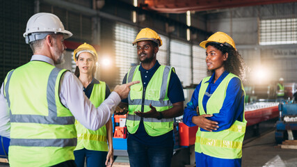 Engineers or foreman inspecting and check up machine at factory machines. Worker industry working in the metal sheet company.