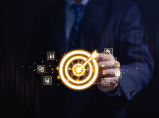 Businessman showing target virtual darts icon arrow. Goal concept for business investment....