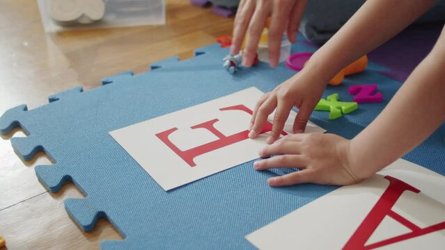 Through creative play and personalized instruction, a child receives support from a caring female tutor and therapist, unlocking their potential for happy learning and improved speech