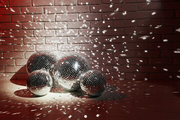 Many shiny disco balls in dark room. Space for text