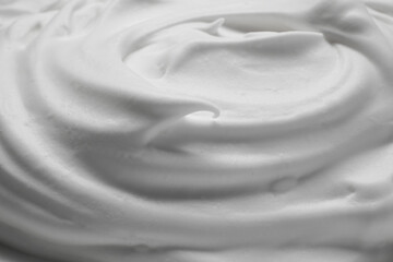 Texture of white shaving foam as background, closeup