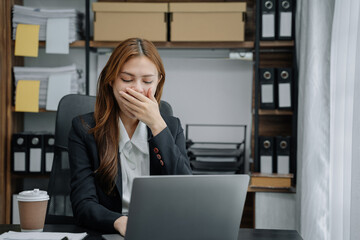 Asian businesswoman works at home until her body is tired, she is drowsy during the daytime. female...