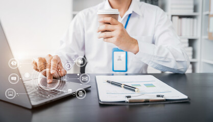 Businessman use laptop computers for laptop payments, online shopping, omni channels, sitting at desks.