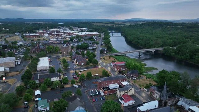 Downtown Milton, Pennsylvania with drone video pulling back wide shot.