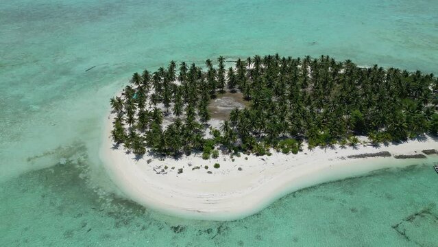 Aerial trucking pan across onok island in Balabac Palawan, clear tropical day