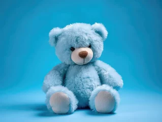 Möbelaufkleber Blue teddy bear on blue background with copy space for your text, cuddly stuffed animal. Baby shower for newborn. generative AI © matteo