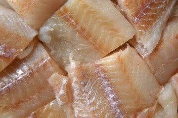 Raw fish fillet is spinning. Top view. Slices of fresh whitefish. Full frame. Sashimi rotation....