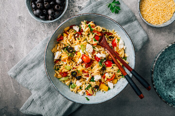 Homemade orzo pasta salad with feta, olives, tomatoes