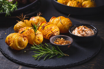Hasselback potatoes with additional herbs, spices and whipped feta dip