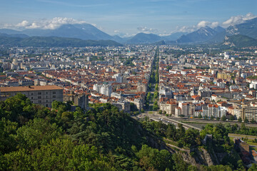 Fototapeta na wymiar GRENOBLE, FRANCE, June 12, 2023 : The city as seen from the fortress of La Bastille, overlooking the flattest city in France.