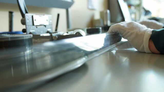 Rolling  film negative in the archive laboratory. Vilnius, Lithuania - 04 10 2023