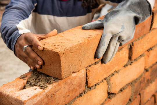 Happy Indian Male Construction Worker Constructing Brick Wall - Hard Working Concept, Manual Labour