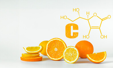 Citrus fresh fruits and formula of vitamin C on white background with copy space. Healthy balance lifestyle concept - obrazy, fototapety, plakaty
