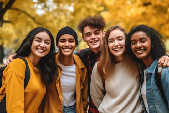 A group of diverse students, surrounded by vibrant autumn leaves, joyfully embracing each other and laughing. Generative AI