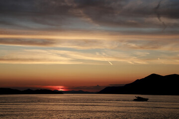 Motorboat heading home at sunset