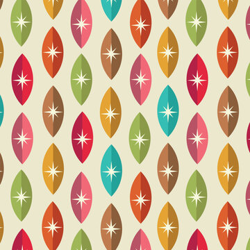 Mid century modern atomic starbursts on colorful geometric leaves seamless pattern in orange, green, brown, red, pink and yellow. For home decor, retro backgrounds and wallpaper 