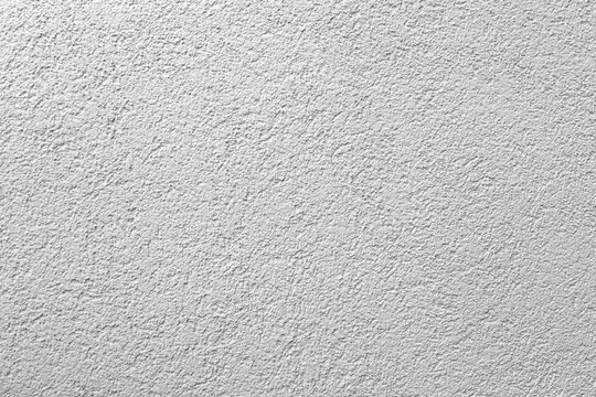 Textured gray abstract background. Monochrome image of gypsum plaster for overlay in design. High quality photo