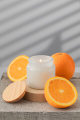 White interior candle in glass with orange fragrance. Handmade candle. Hugge
