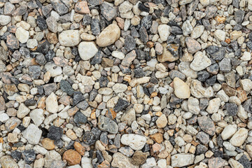 Top view of the pebbles stone on the floor. beautiful small stone and big stone on the beach background texture.