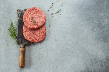 Raw veal mince Burger steak cutlets on a light background, Restaurant menu, dieting, cookbook...