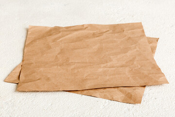 top view with baking parchment empty on table background. Folded cloth for mockup with copy space,...