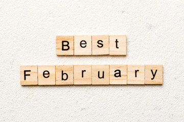 best February word written on wood block. best February text on table, concept