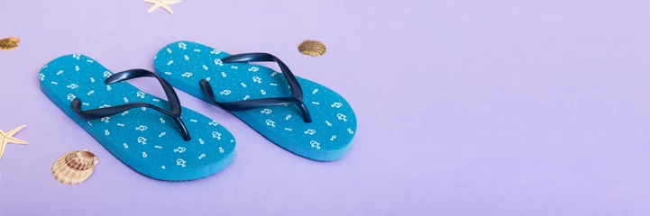 Türaufkleber Beach accessories. Flip flops and starfish on colored background. Top view Mock up with copy space © sosiukin