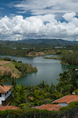 Fototapeta na wymiar Aerial panoramic view of the hydroelectric reservoir, lakes, mountains and many small islands of Guatape, near Medellin, Colombia. Sunny day, blue sky.