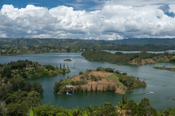 Fototapeta premium Aerial panoramic view of the hydroelectric reservoir, lakes, mountains and many small islands of Guatape, near Medellin, Colombia. Sunny day, blue sky.