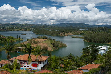 Fototapeta na wymiar Aerial panoramic view of the hydroelectric reservoir, lakes, mountains and small islands of Guatape, near Medellin, Colombia. Sunny day, blue sky.