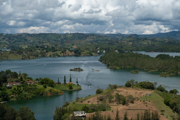 Obraz premium Aerial panoramic view of the hydroelectric reservoir, lakes, mountains and many small islands of Guatape, near Medellin, Colombia. Sunny day, blue sky.