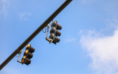Vibrant street traffic lights illuminate the urban landscape, symbolizing order, control, safety,...