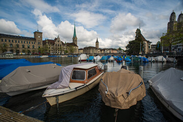 Sail boats parked in a river harbor. Limmat river Zurich, Switzerland, daytime, no people