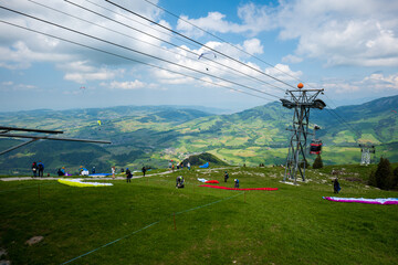 Fototapeta na wymiar Paragliders preparing to take off in the Ebenalp, appenzell region of Switzerland