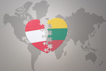 puzzle heart with the national flag of lithuania and austria on a world map background.Concept.