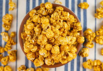 Bowl with delicious caramel popcorn. Homemade Fresh Popped Caramel PopCorn. Sweet caramel flavoured popcorn in bowl.