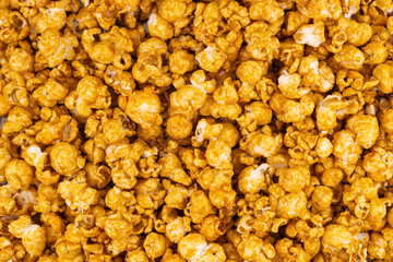 Delicious caramel popcorn. Homemade Fresh Popped Caramel PopCorn. Sweet caramel flavoured popcorn background