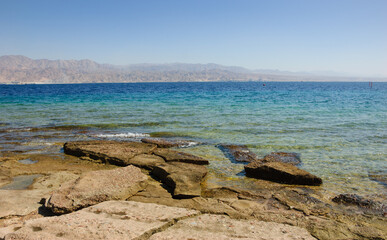 Eilat, Israel. View from Eilat's Coral Beach towards Aqaba in Jordan. Coral Beach Nature Reserve in Eilat, one of the most beautiful coral reef in the world, is famous tourist and diver attraction.